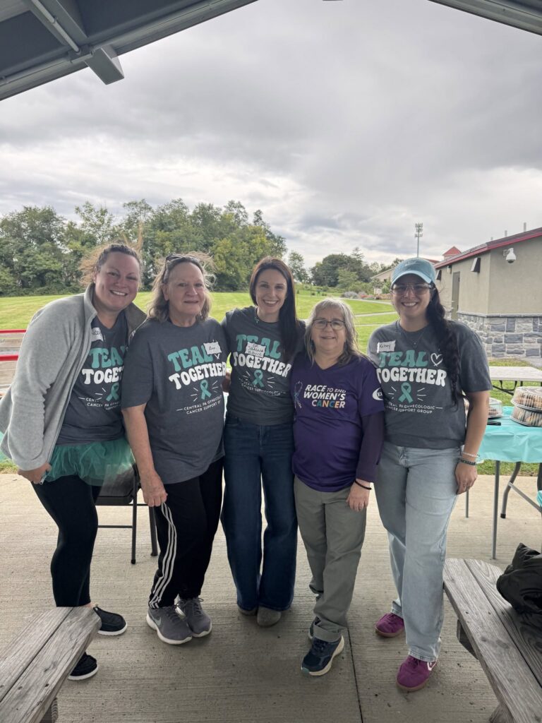 Events Five volunteers in Teal Together shirts at the September 2026 awareness walk at Patriot Park